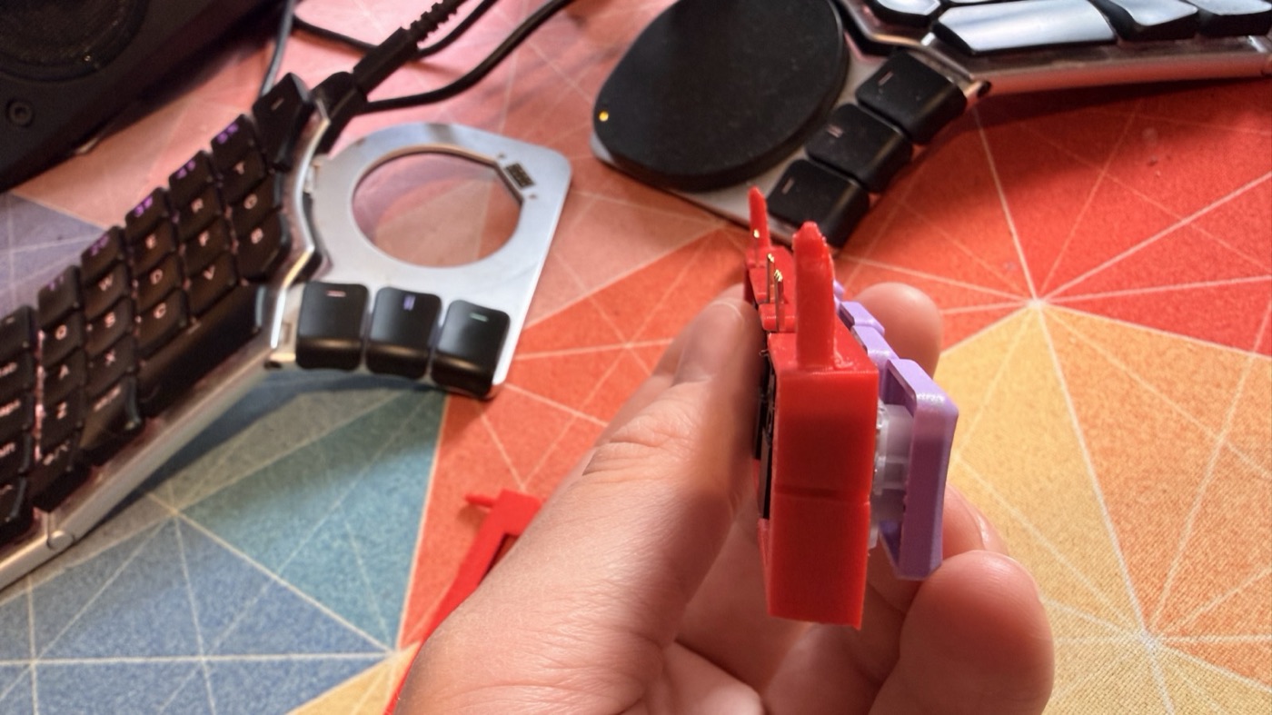 End view of a key module with the header pins and a guide pin sticking out